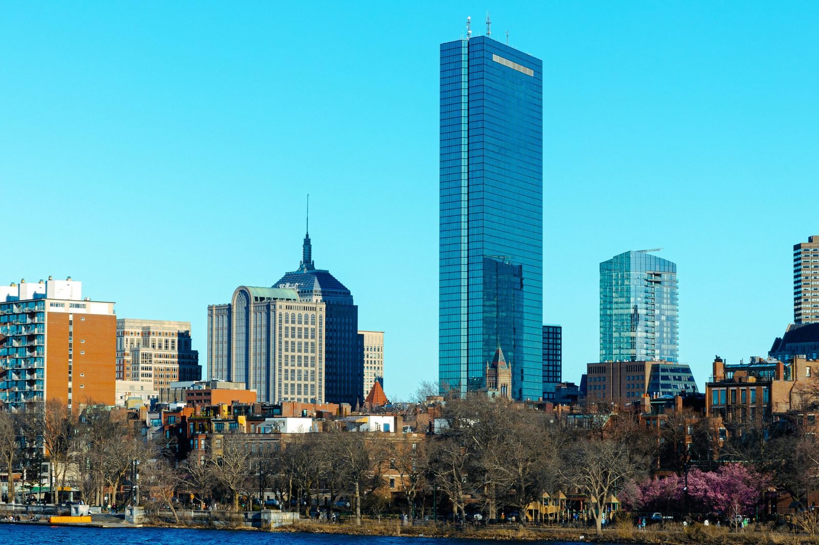 Boston skyline with Hancock Tower and blue sky, the host city for Boston Tech Week 2026