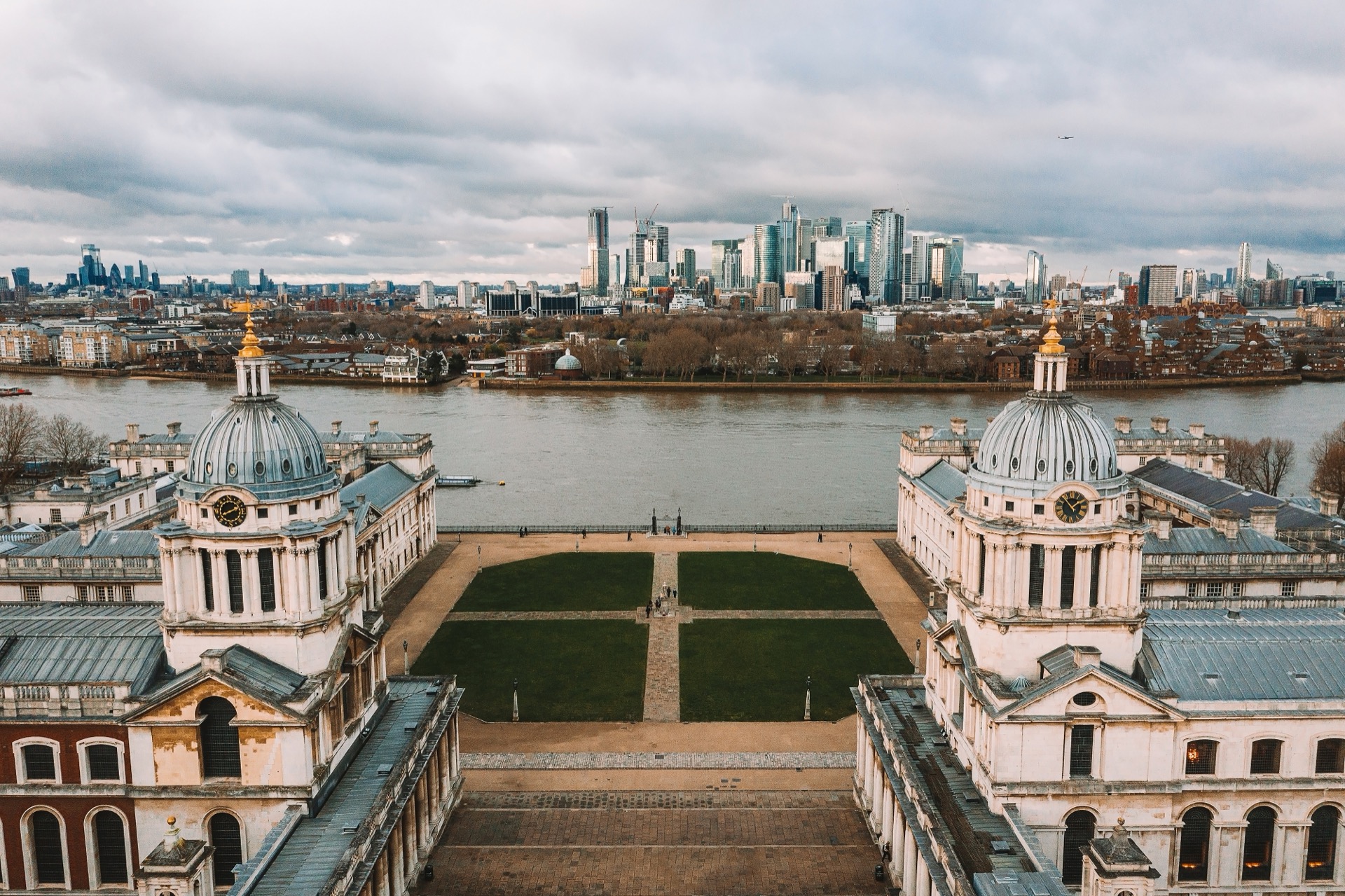Aerial view of Greenwich and London skyline, showing the city's diverse business districts