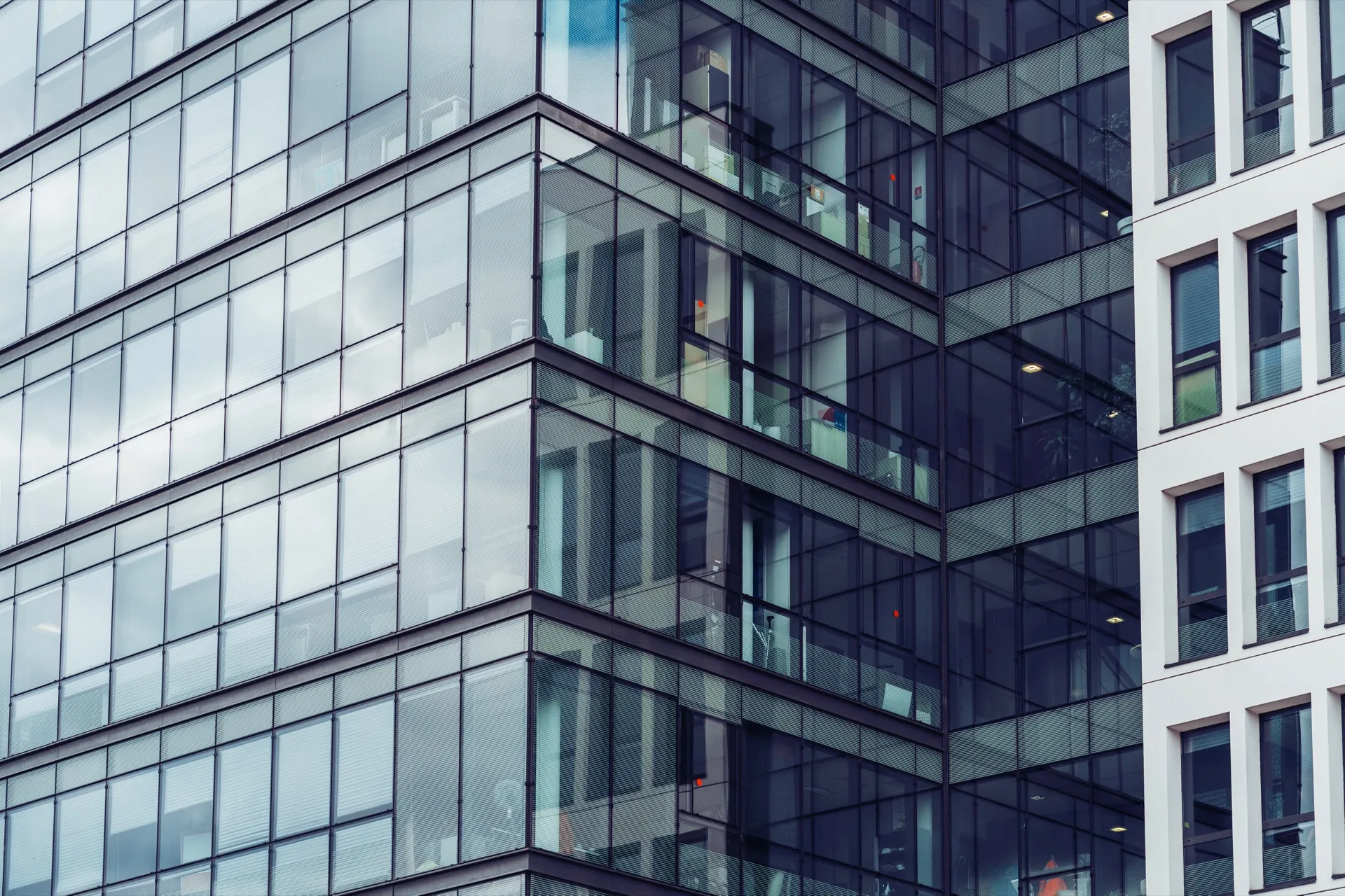 Modern office building facade representing fixed office infrastructure
