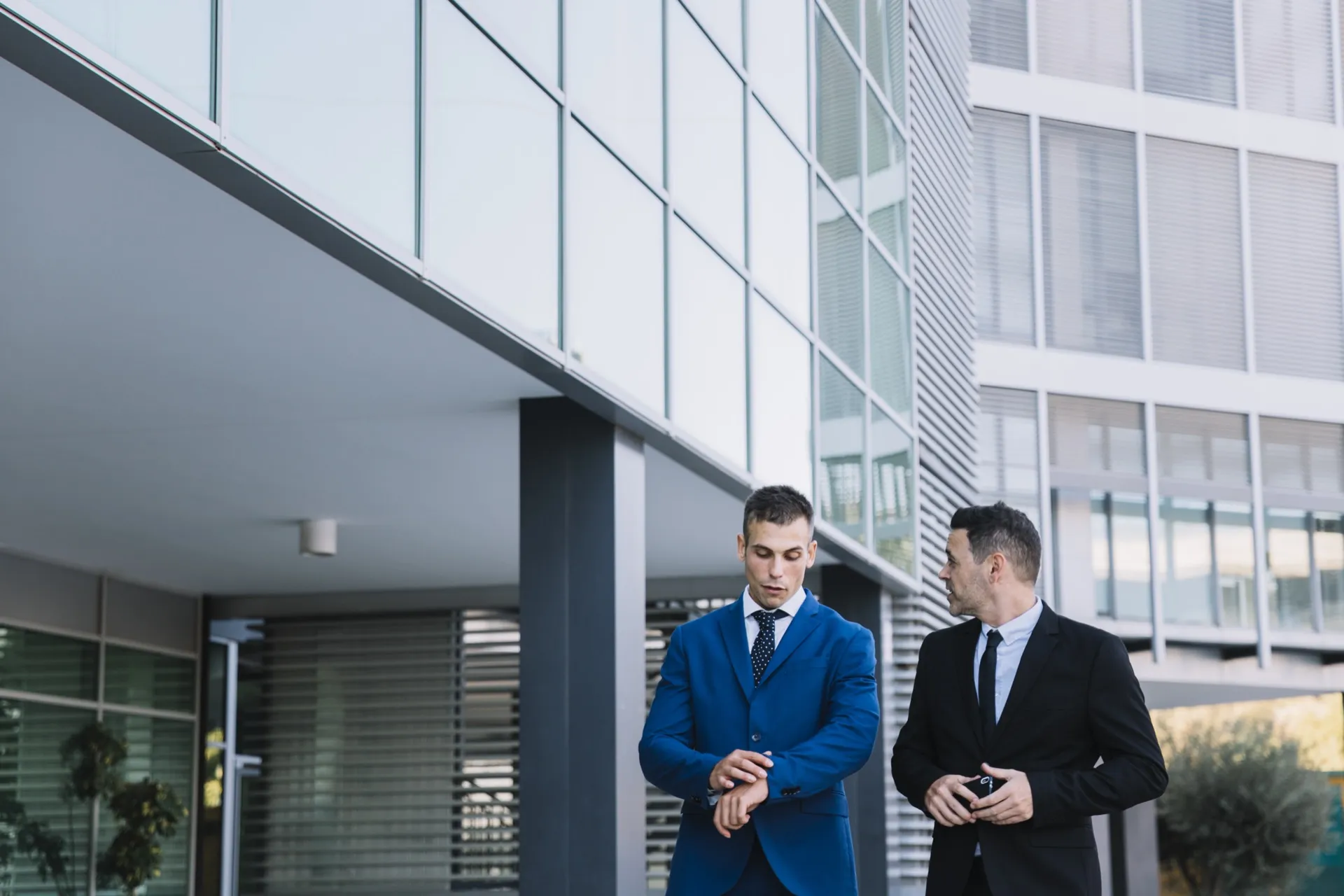 Two corporate managers discussing workspace strategy