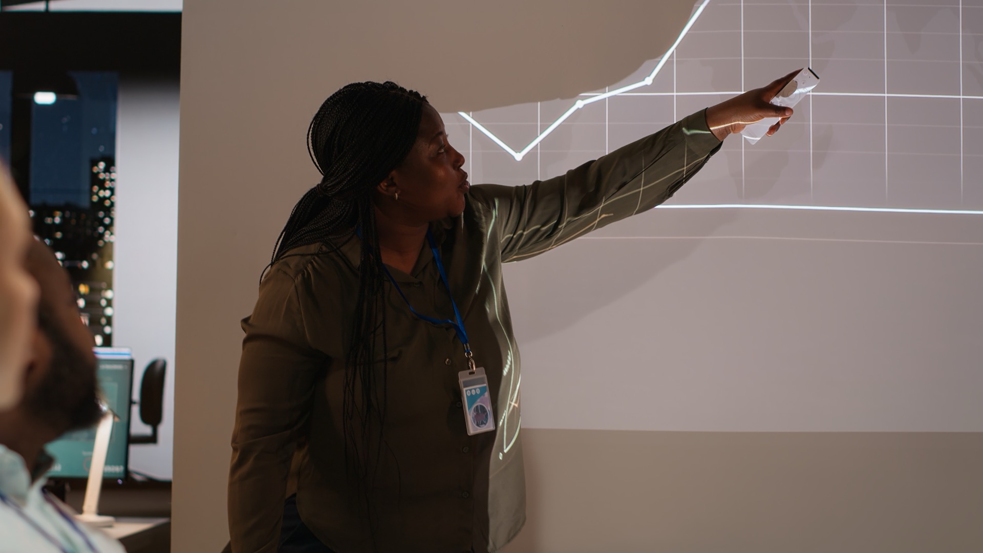 Finance team analyzing workspace demand and utilization data on a dashboard