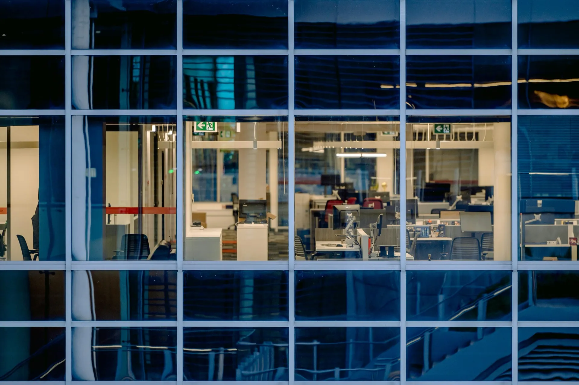 A modern open-plan office space with collaborative work areas and natural light
