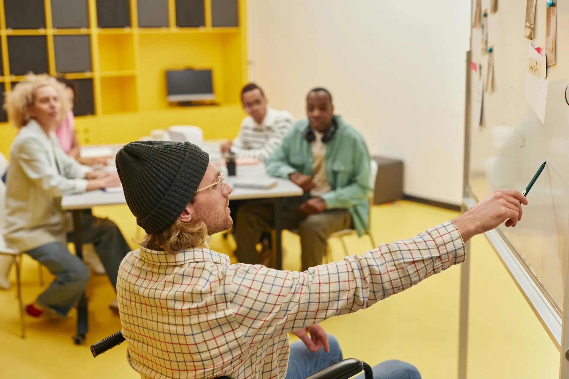 A team meeting in a booked conference room