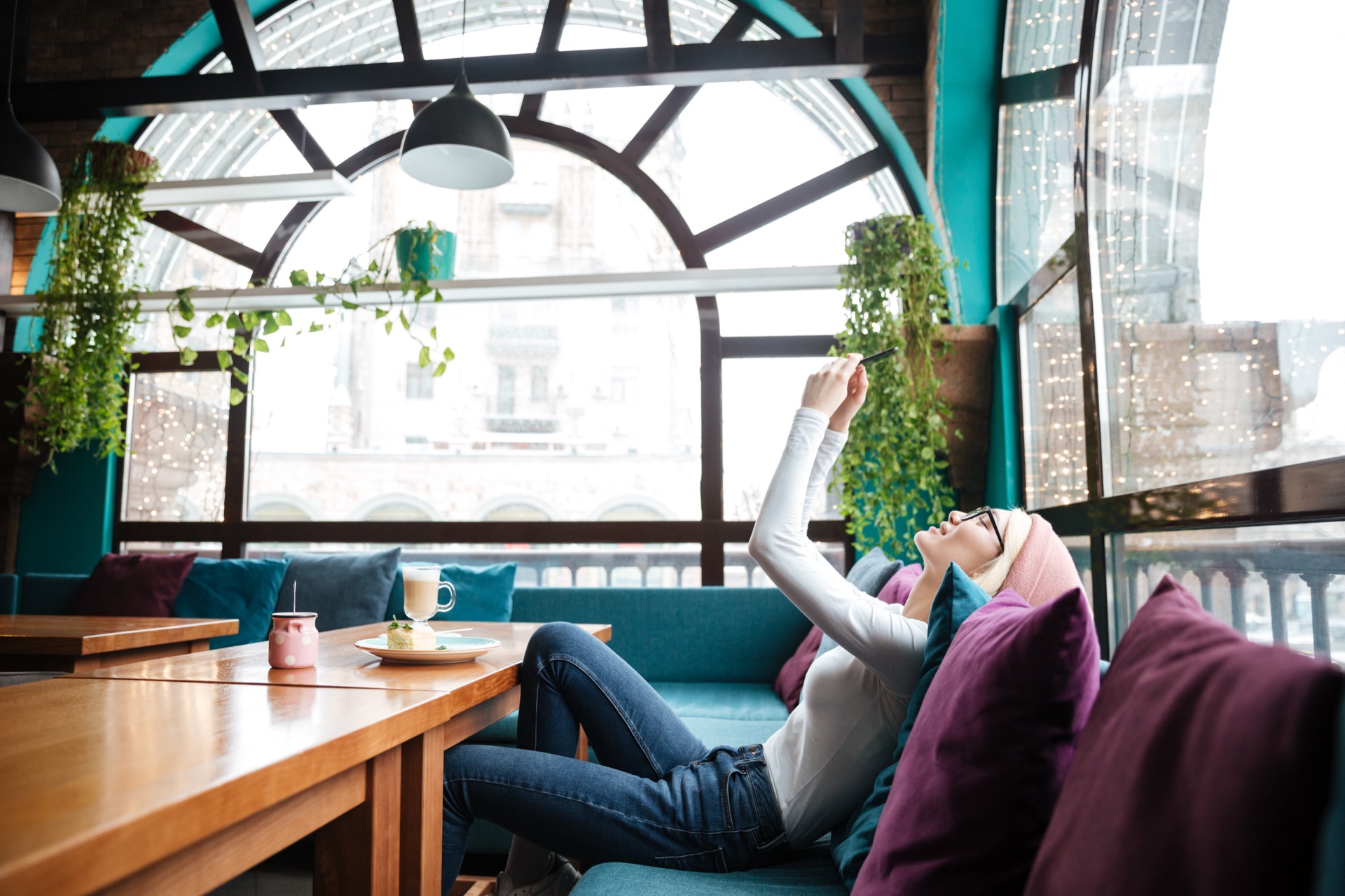 Remote worker using mobile phone in a flexible workspace