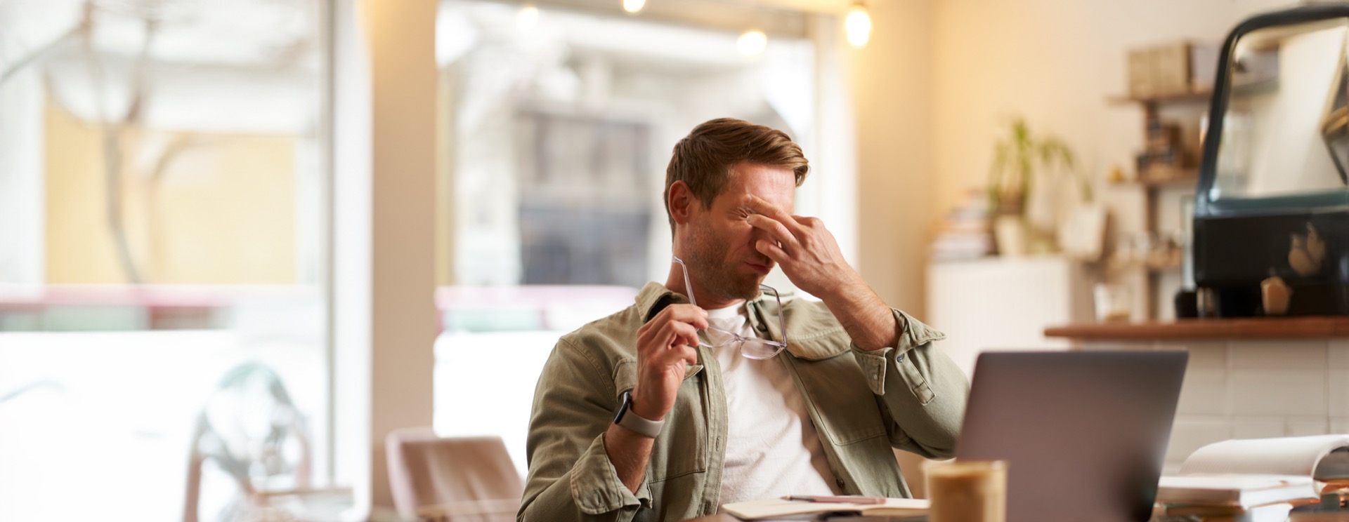 Worker experiencing fatigue from hybrid work challenges